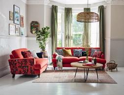 DFS Joules Patterdale four-seater sofa in plain coral velvet and cuddler in navy and coral pattern velvet