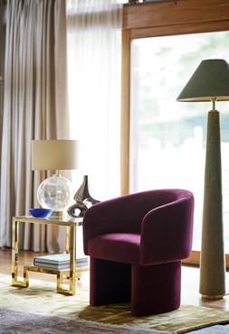 DFS Lina Lamp Table in Champagne Gold, Dwell Eisha Dining Chair in Wine Velvet, Dwell Zuriel Medium Rug in Mustard, available at DFS
