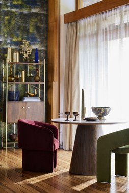 Dwell Negozio Mango Wood Shelving Unit, available at DFS Dwell Terzo Dining Table in Walnut, Dwell Eisha Dining Chair in Wine Velvet, Dwell Maali Cutout Velvet Dining Chair in Olive