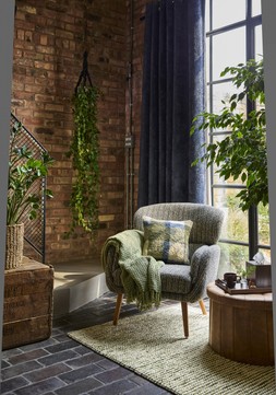 Salvage Yard AW26 - Pelham wing armchair £279 | Nico wool rug, from £69 Round faux-leather ottoman £35