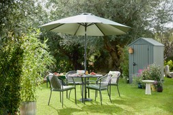 Lisbpm 4 Seat Dining Set Grey £399, Wild Heritage Patterned 45x45 CUSHION £19.99, Sintra Glazed Terracotta Oil Drizzler Ochre £5.99, RSW Floral Picnic Plate in CDU 22cm 2-COL £2.99, Portofino Wine Glasses 4PK Multi Coloured £16.99